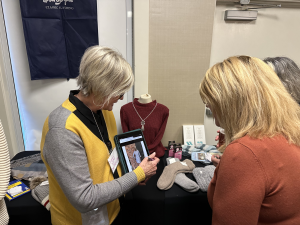 Exhibitor demonstrating products to a prospective customer.